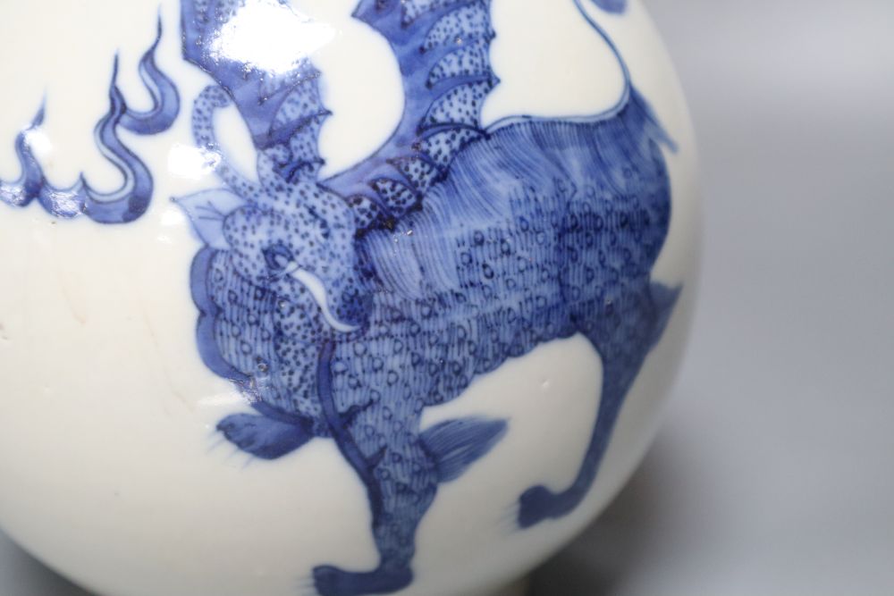 A Chinese porcelain blue and white bottle vase, painted with dragons in underglaze blue